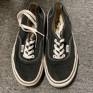 Size 4 (boys). Black and white Vans.